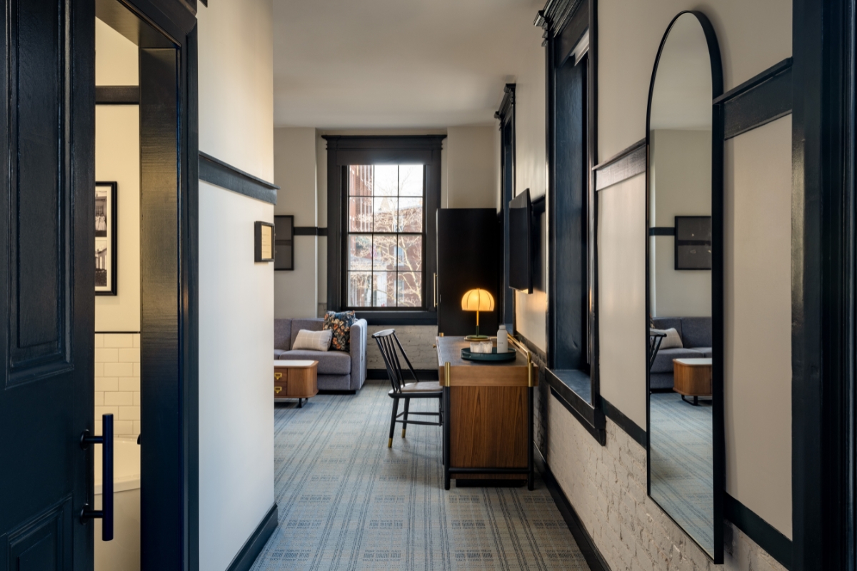 a room with a desk and a mirror