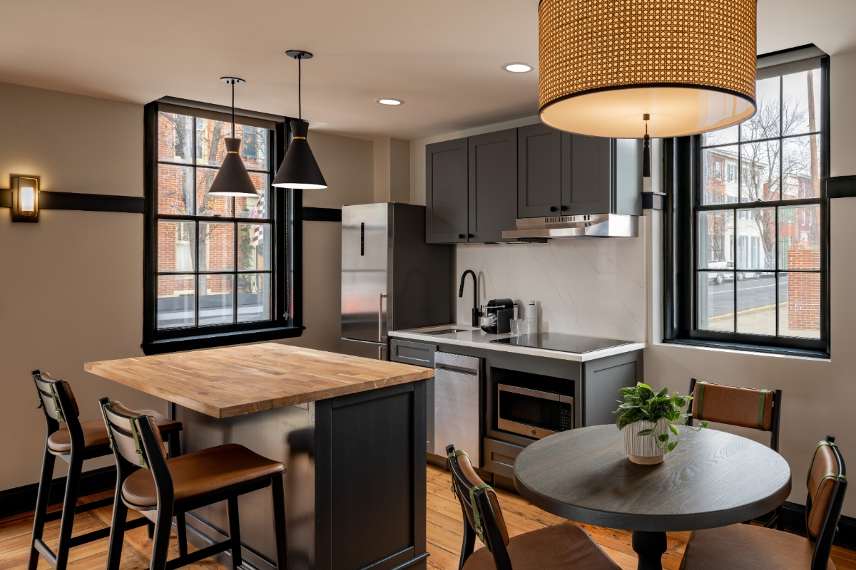 a kitchen with a table and chairs