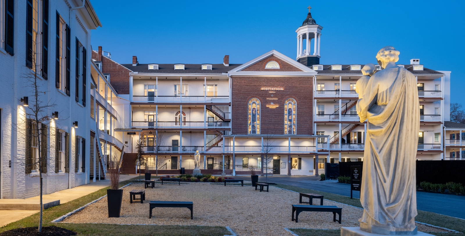 a building with a courtyard and benches