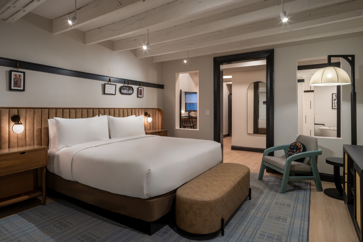 a room with a bed and a chair
