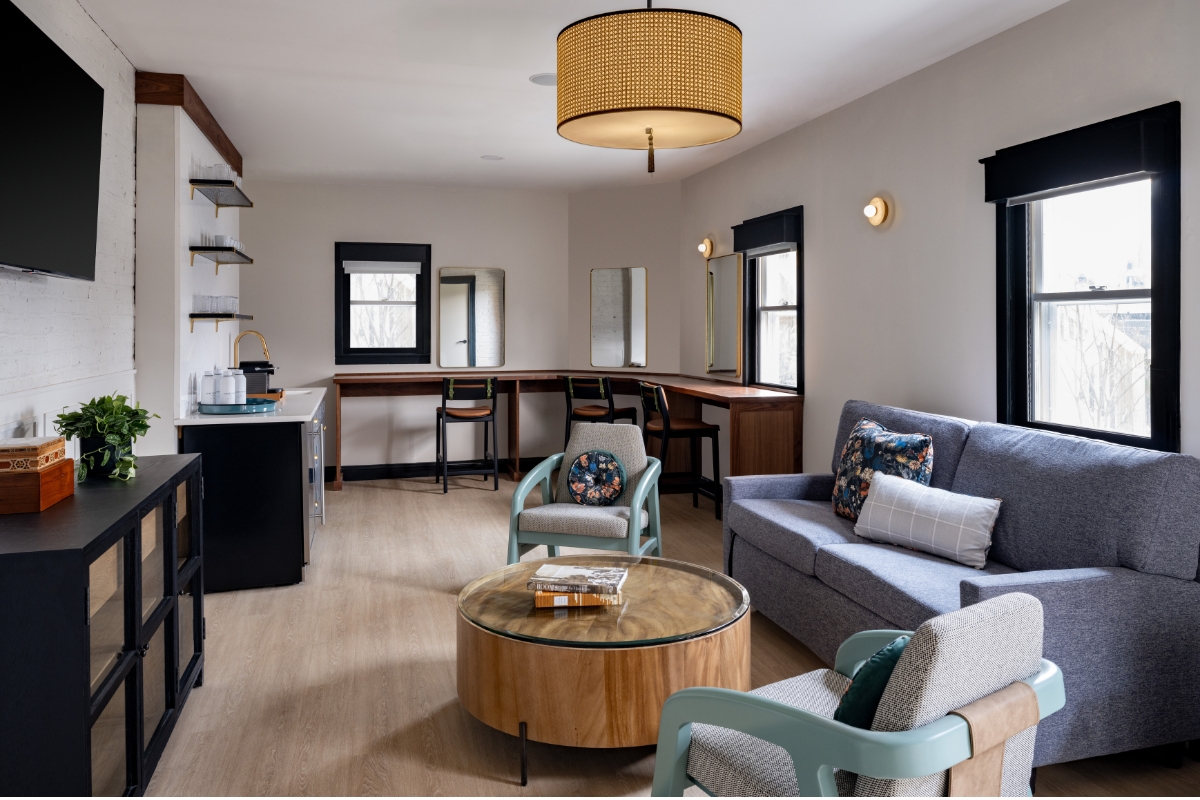 a living room with a couch and chairs