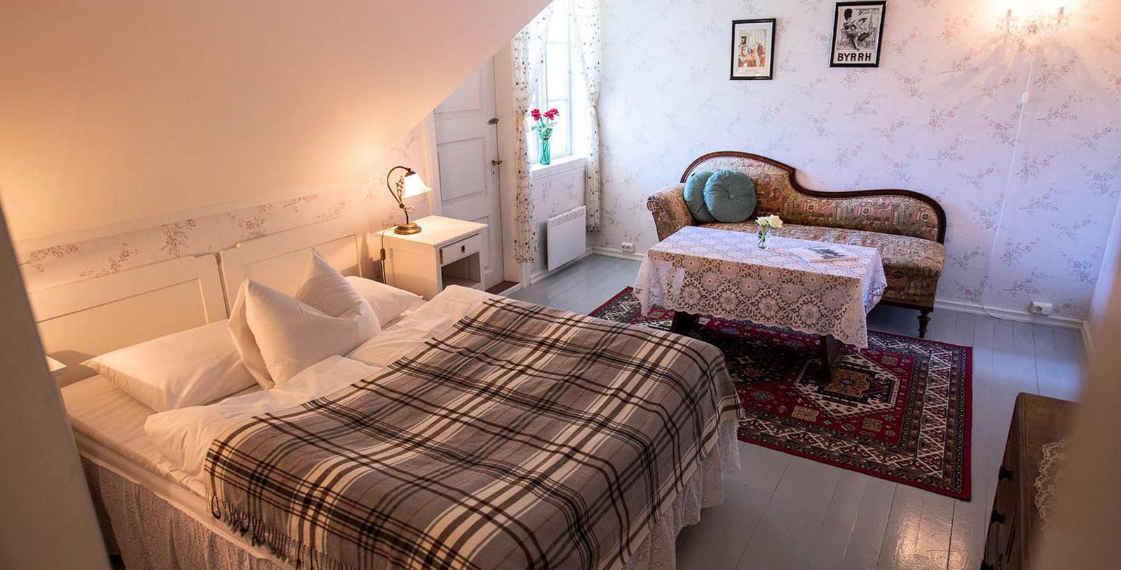 a bedroom with a bed and a table