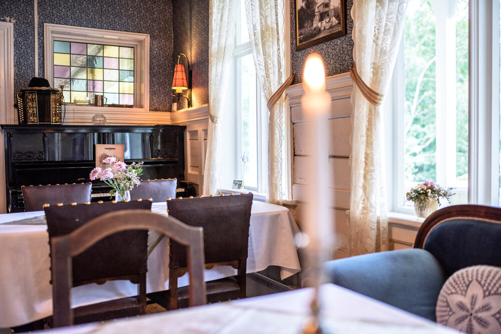 a room with a piano and a table