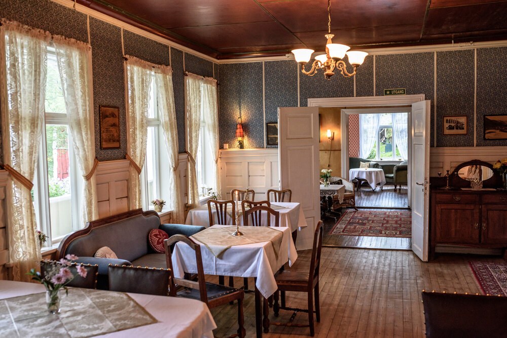 a room with tables and chairs