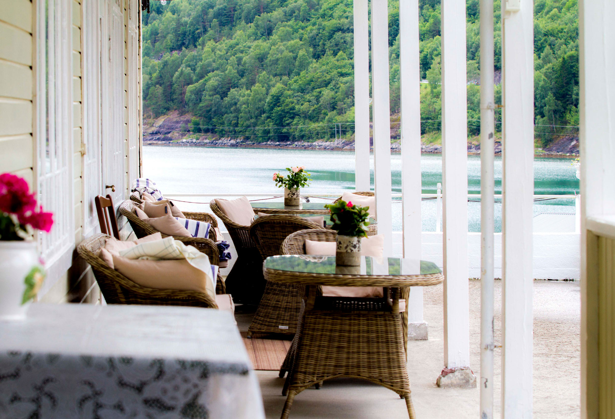 a table and chairs on a porch