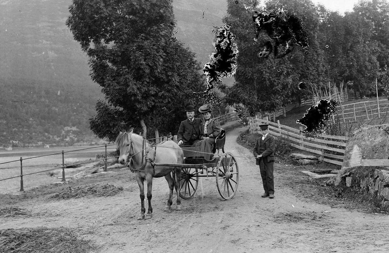 a horse drawn carriage with people on it