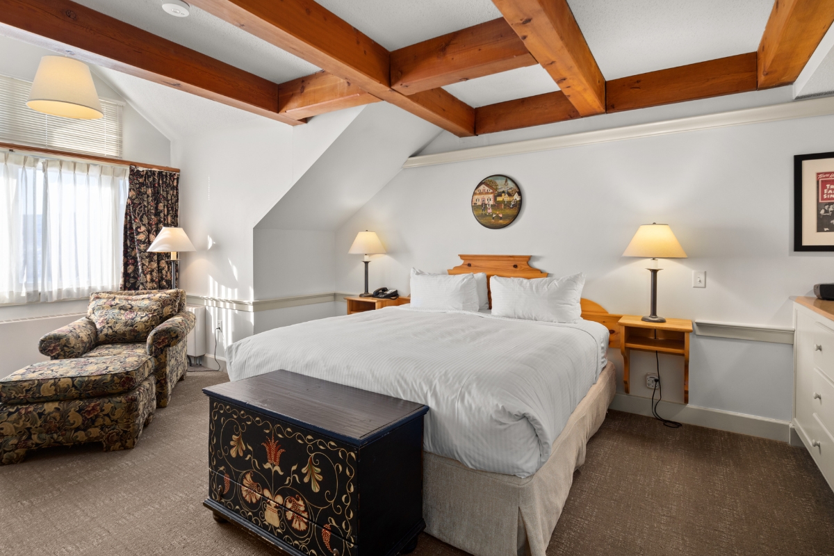 a bedroom with a bed and a couch