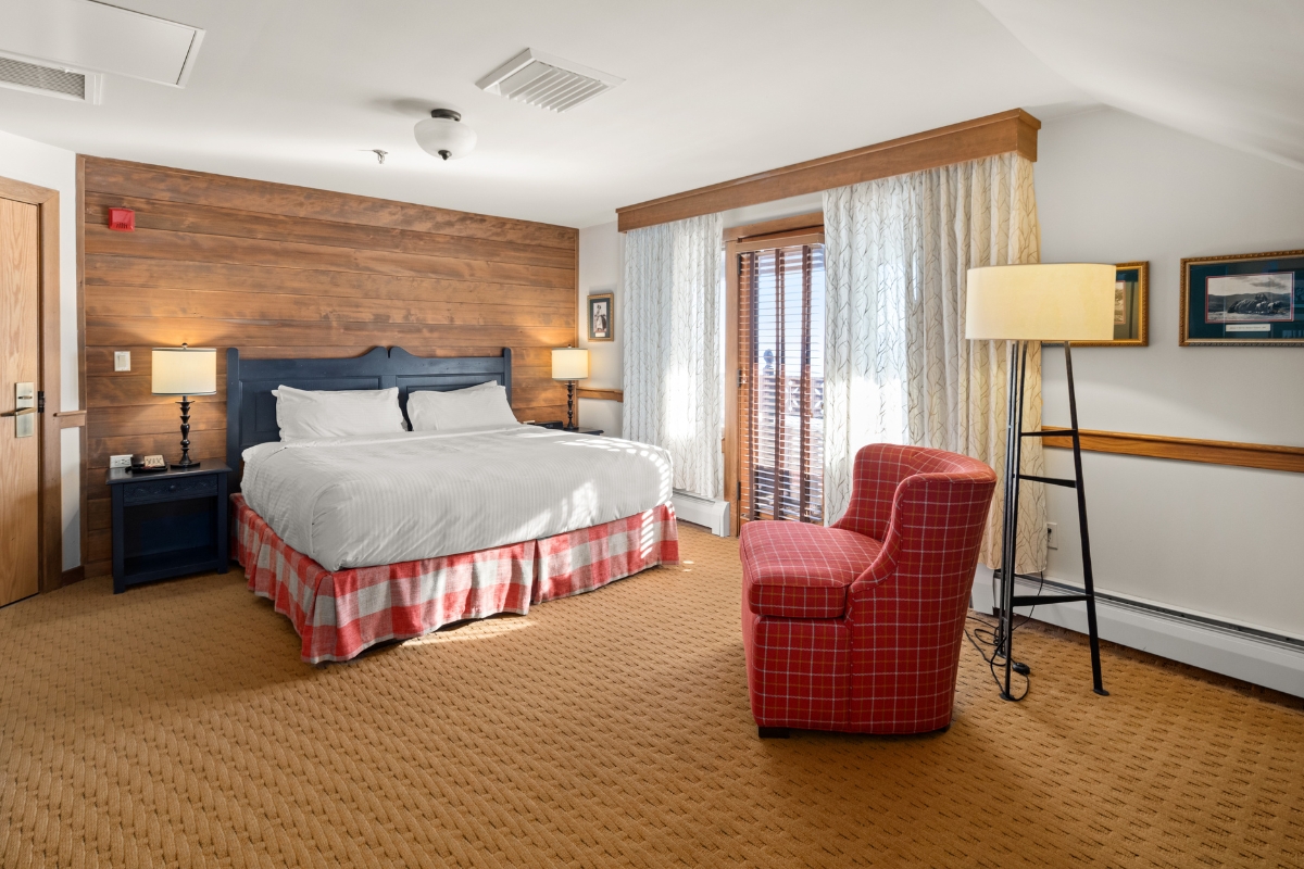 a room with a bed and a lamp