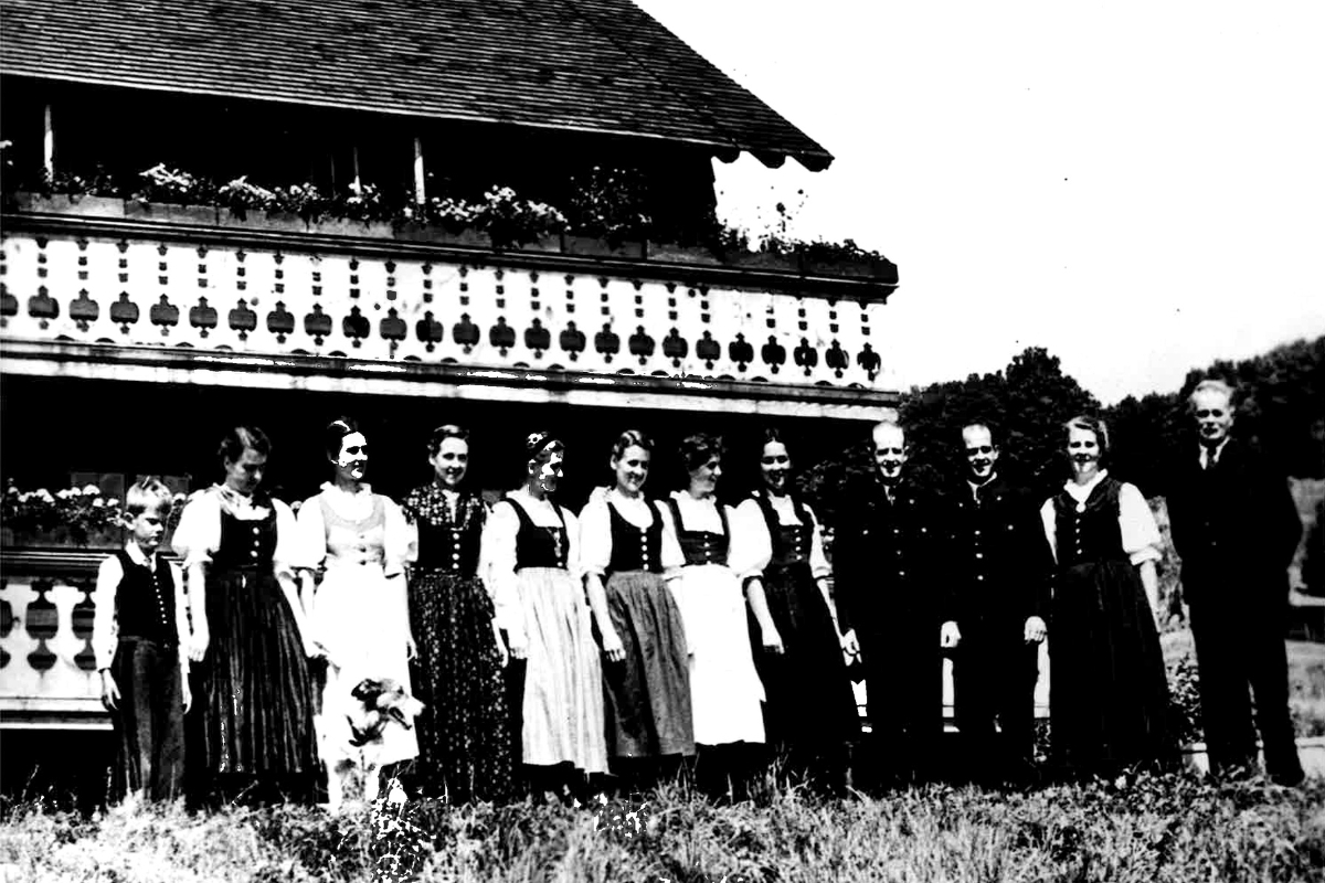 a group of people standing in front of a building