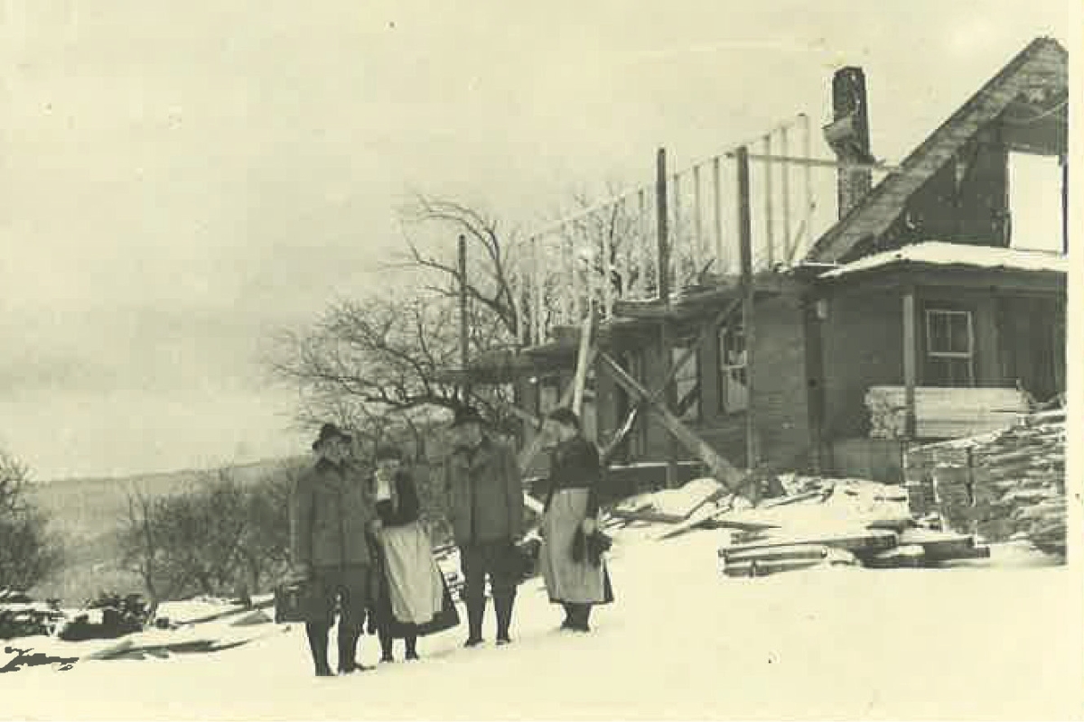 a group of people standing in the snow