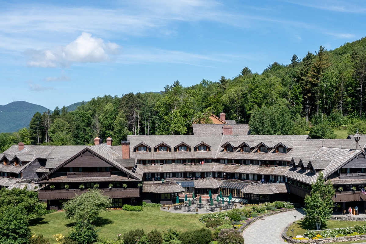 a large building with trees in the background