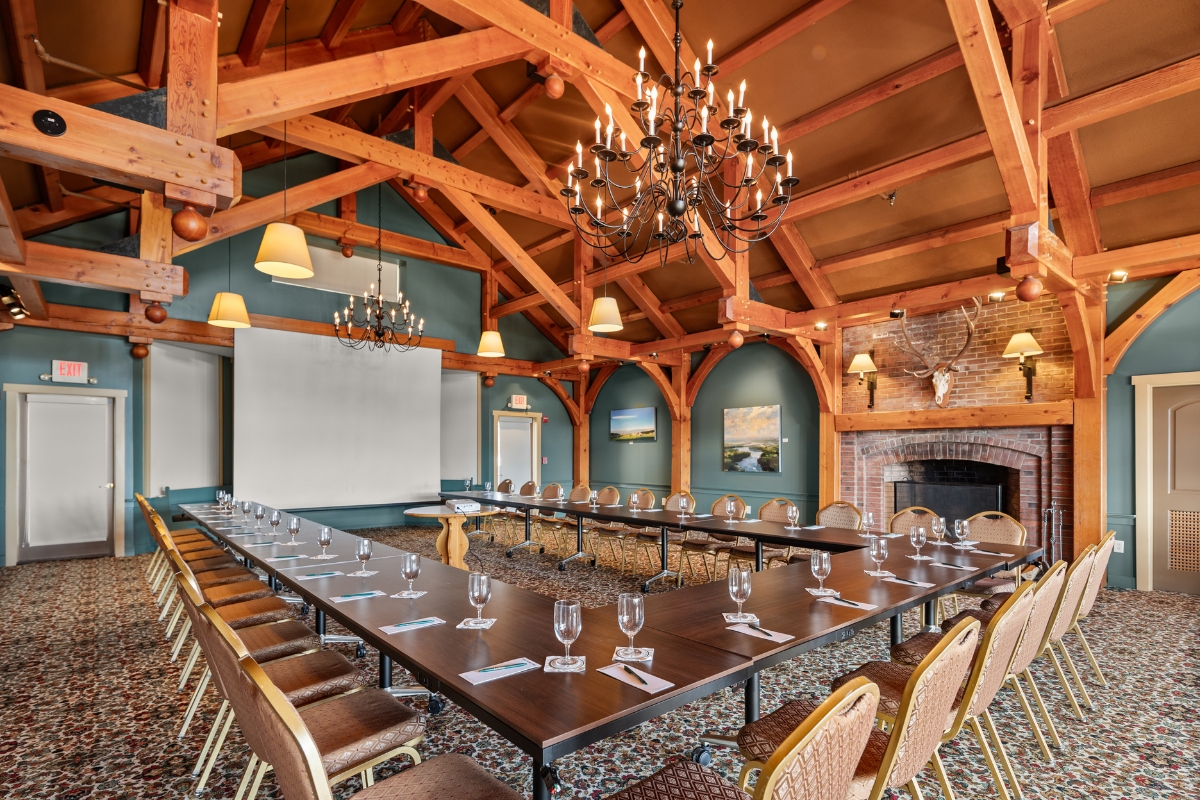 a room with a large table and chairs