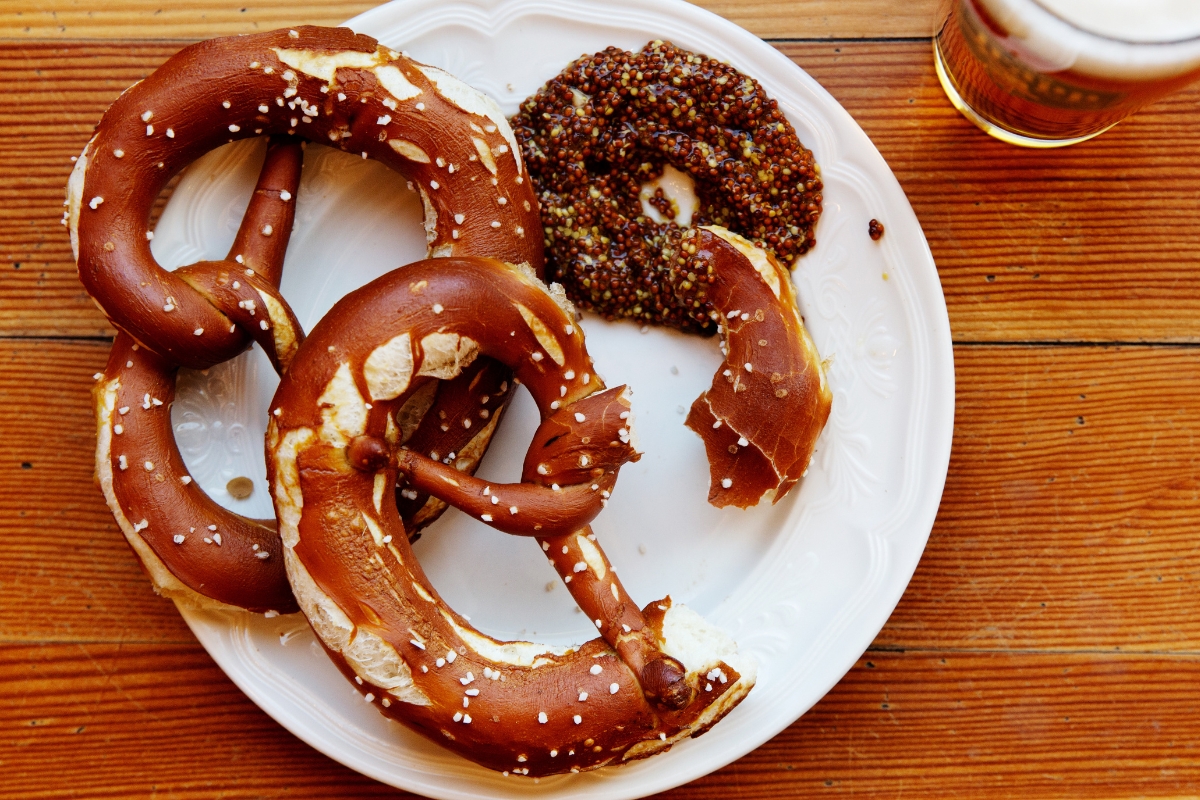 a plate of pretzels and sauce