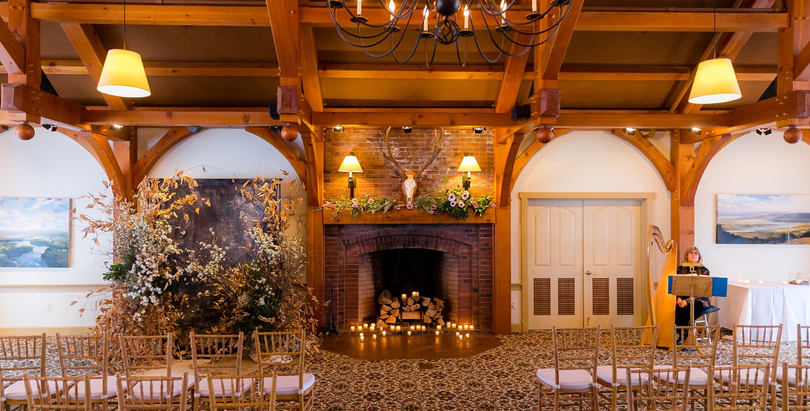 a room with a fireplace and chairs