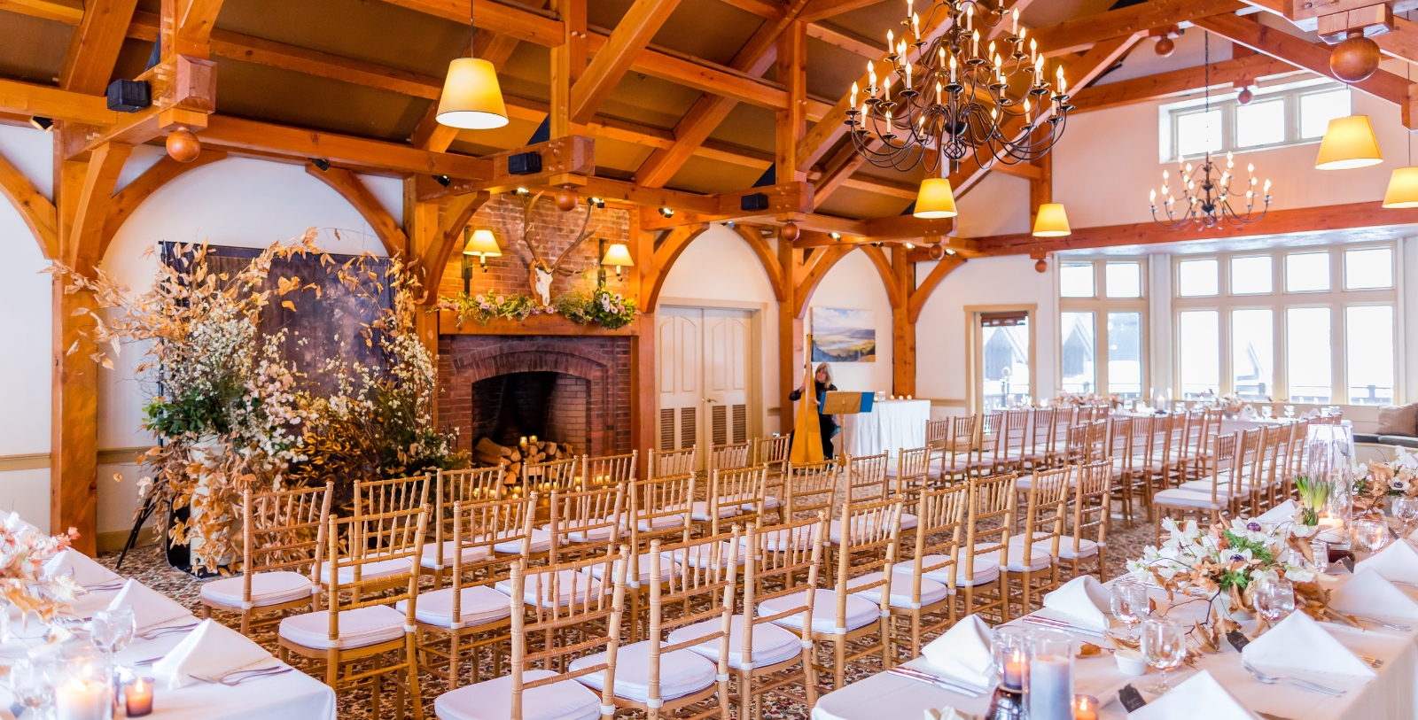 a room with chairs and chandeliers