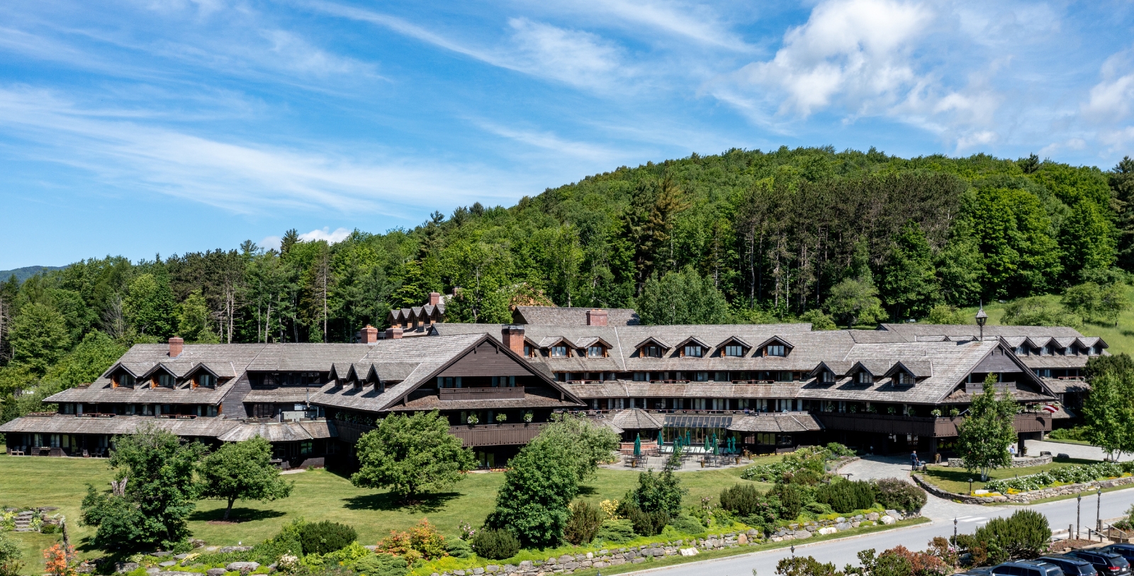 a large building with trees in the background