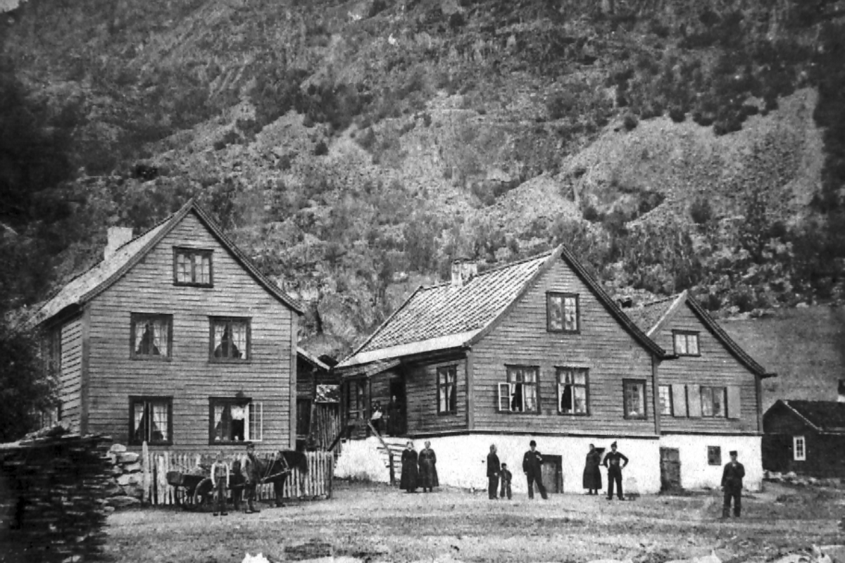 a group of people outside a house