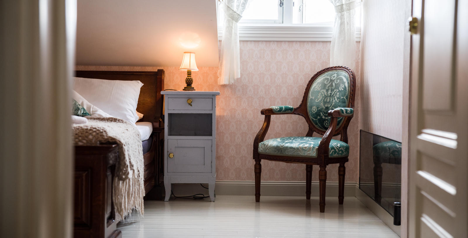 a room with a bed and a chair