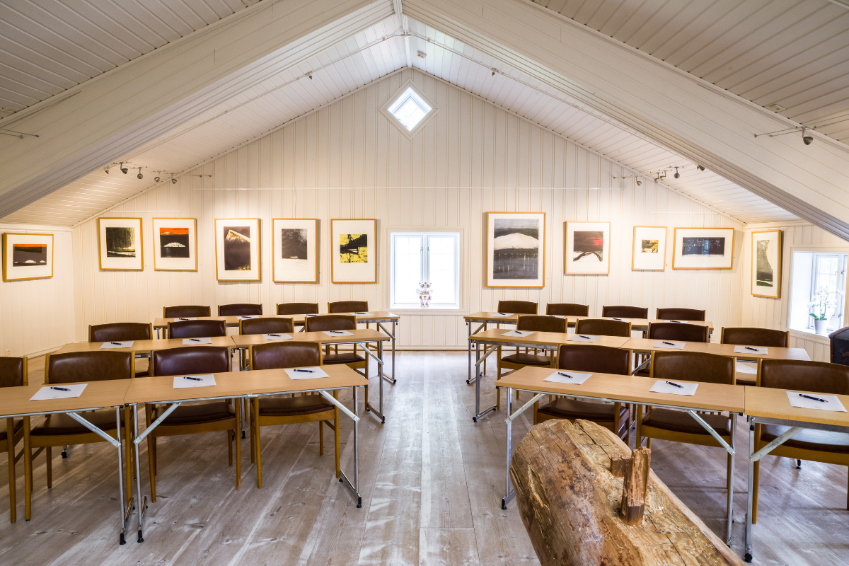 a room with tables and chairs