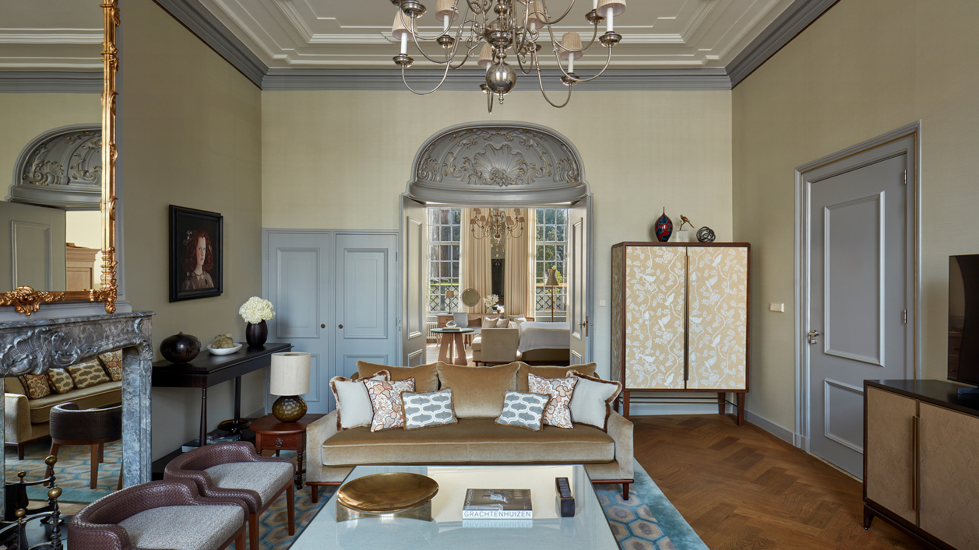 a living room with a chandelier and a couch