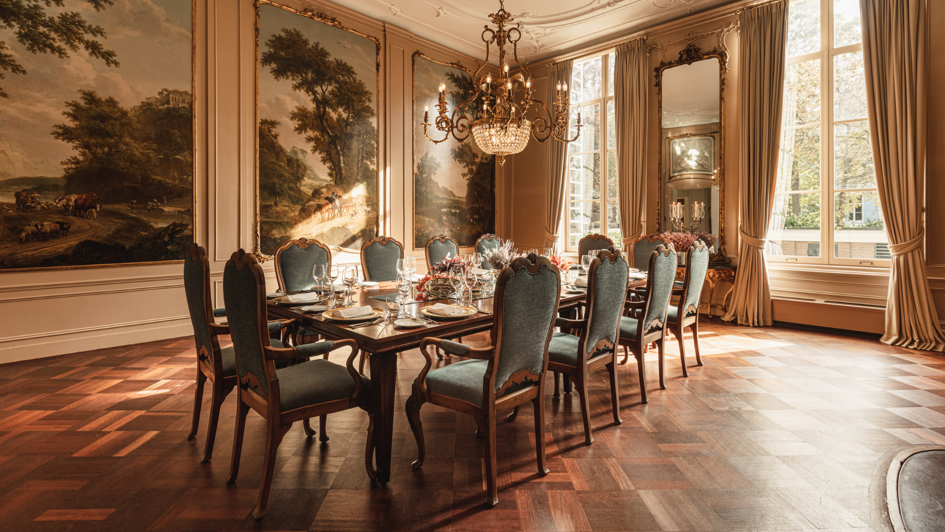a dining room with a chandelier and chairs