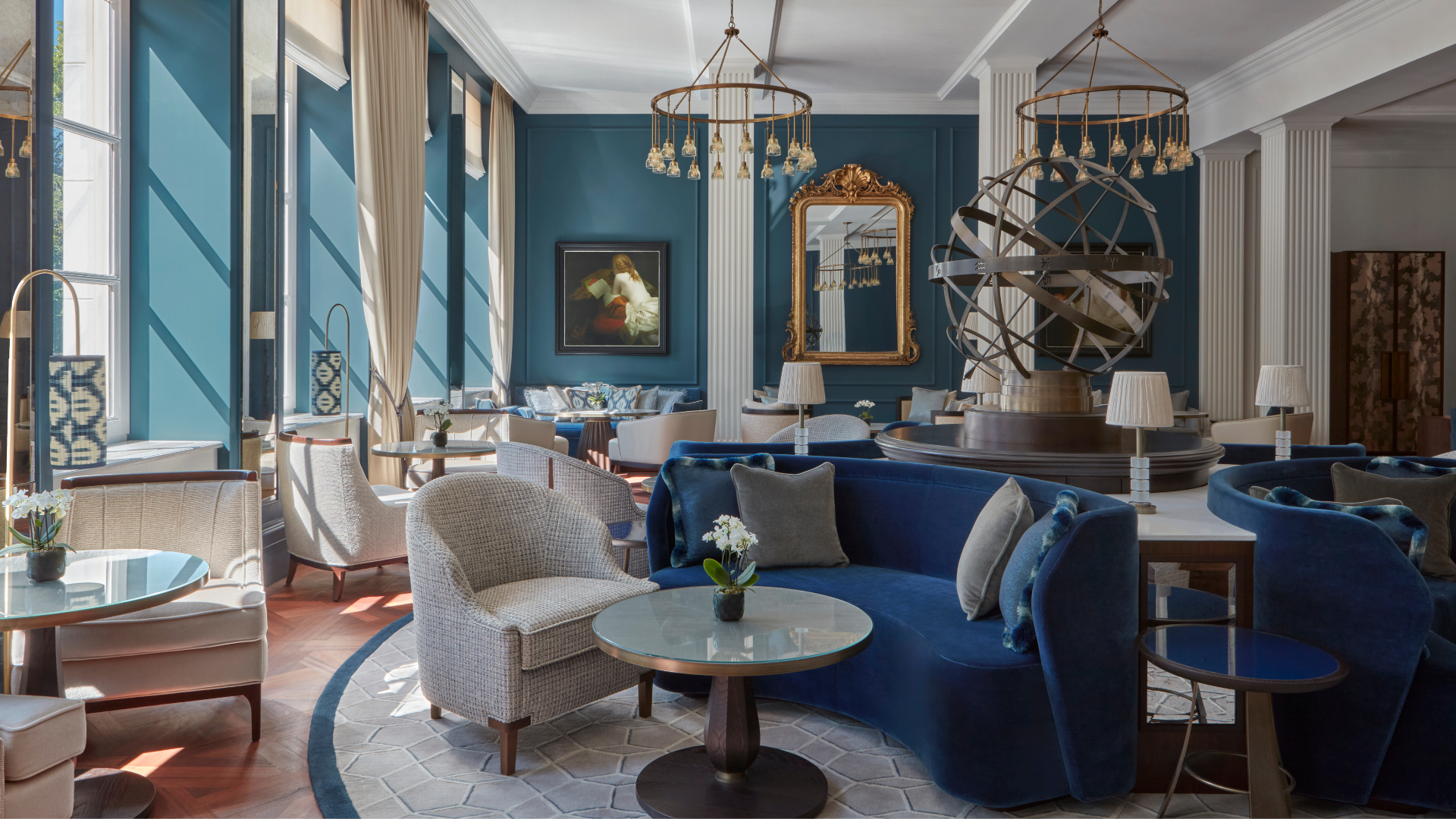 a room with a blue couch and a round table