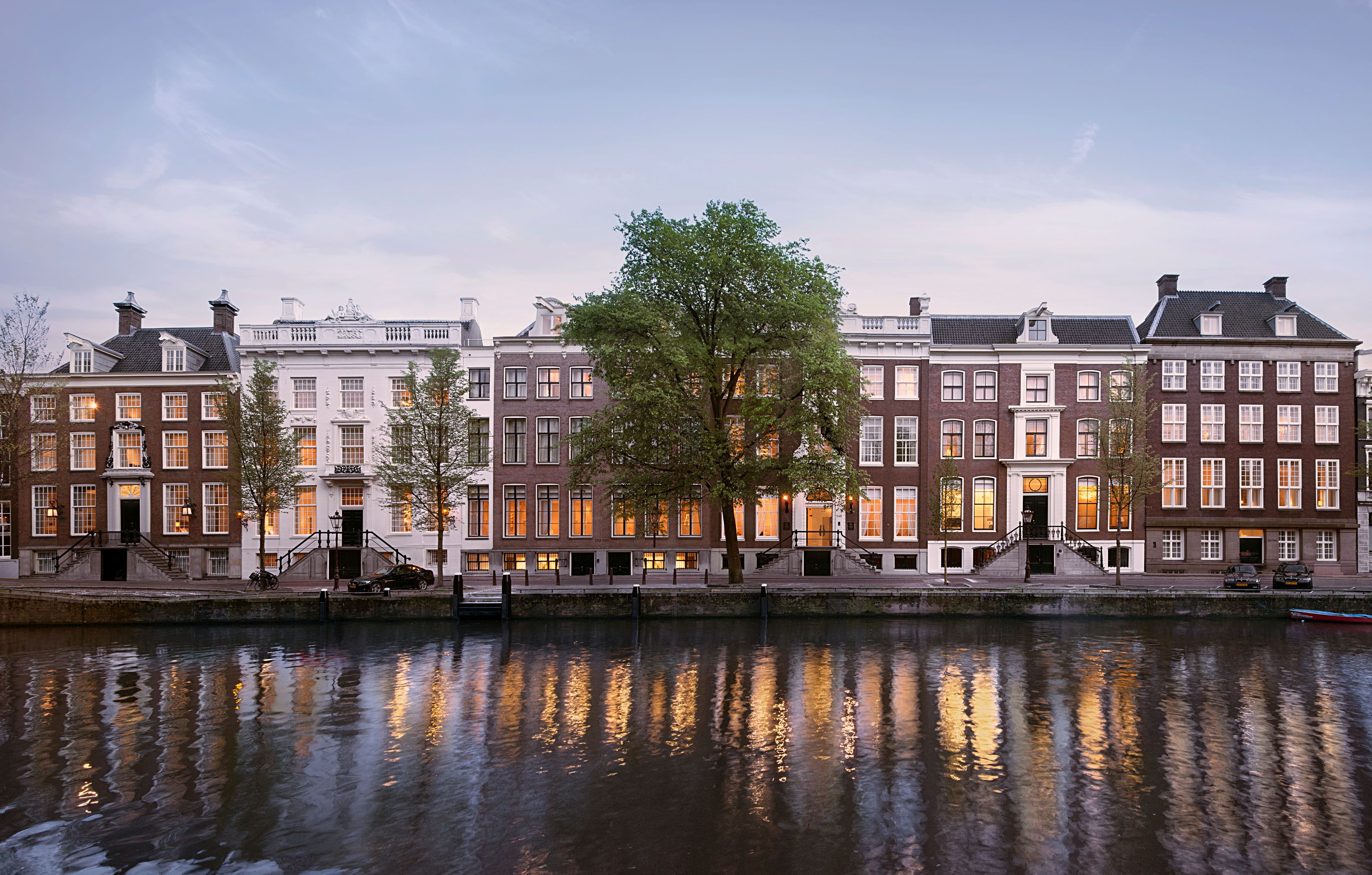 a row of buildings next to a body of water