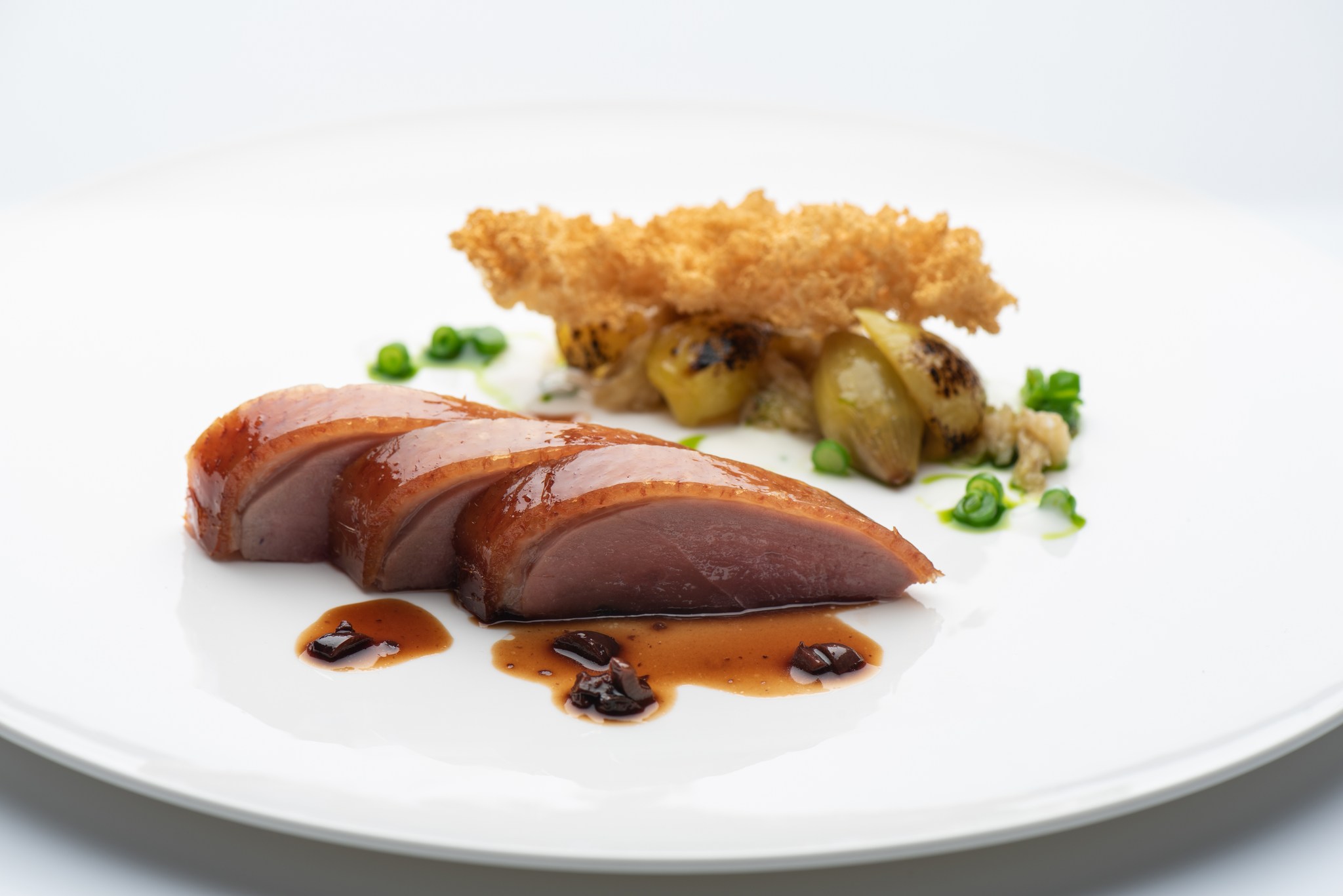a plate of food on a white surface