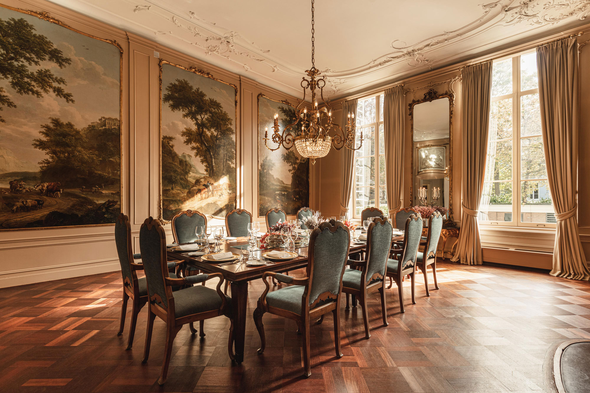 a dining room with a table and chairs
