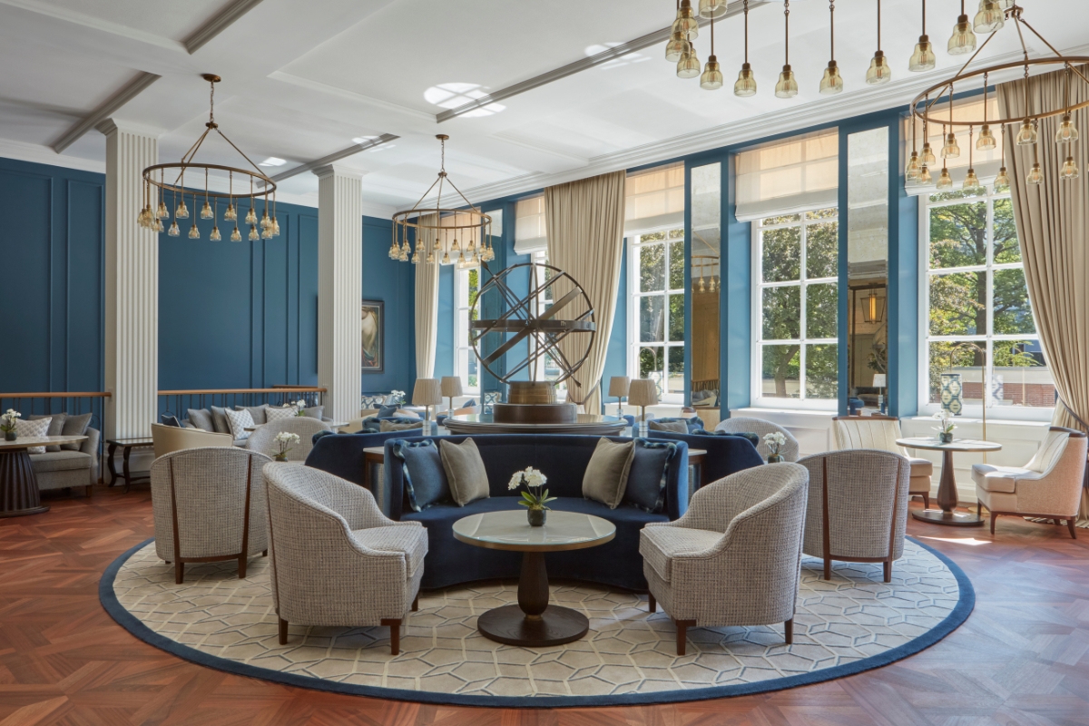a room with a round table and chairs