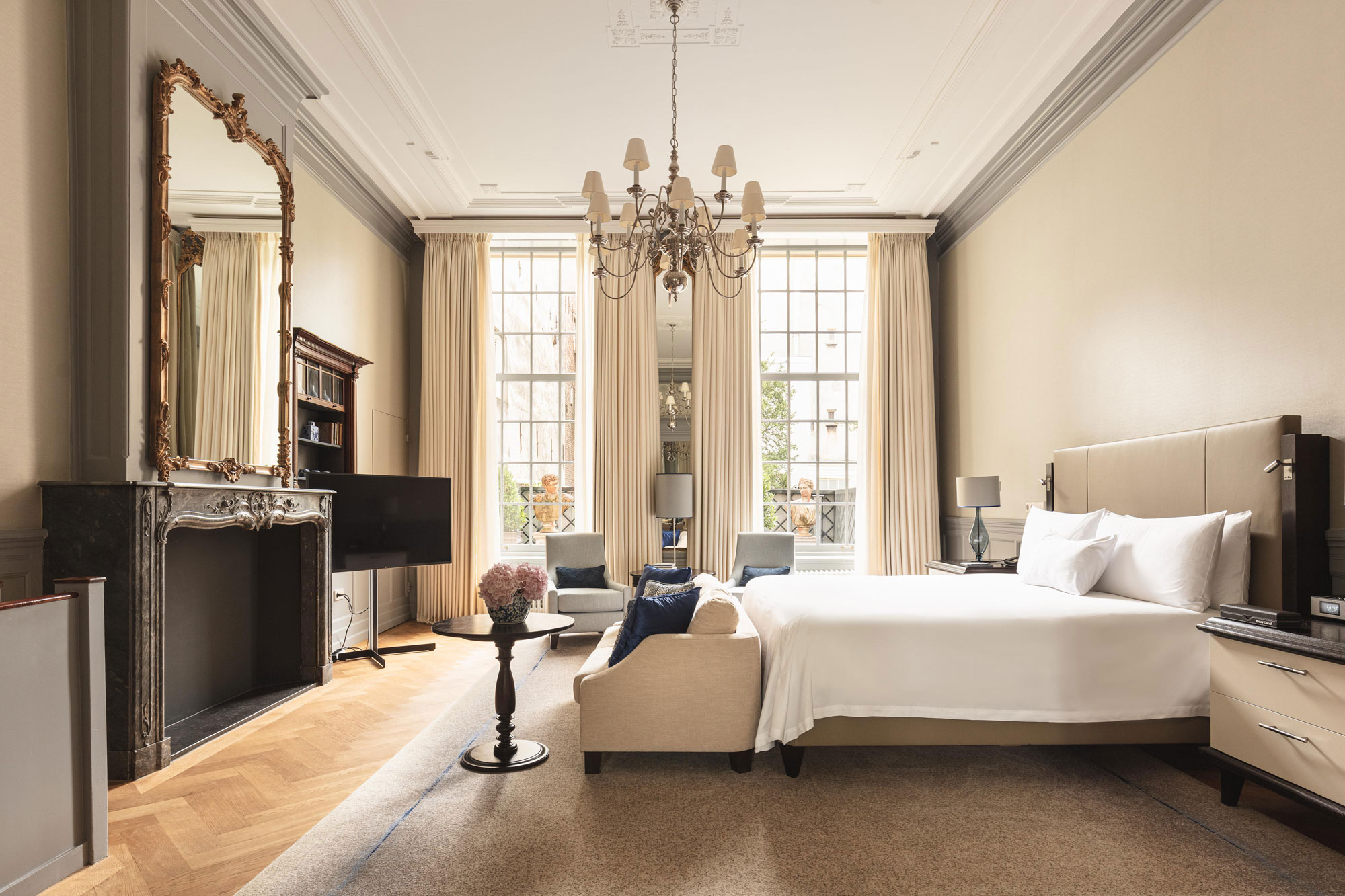 a room with a bed and a fireplace