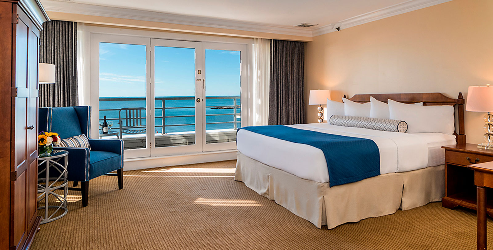 a room with a bed and a glass door