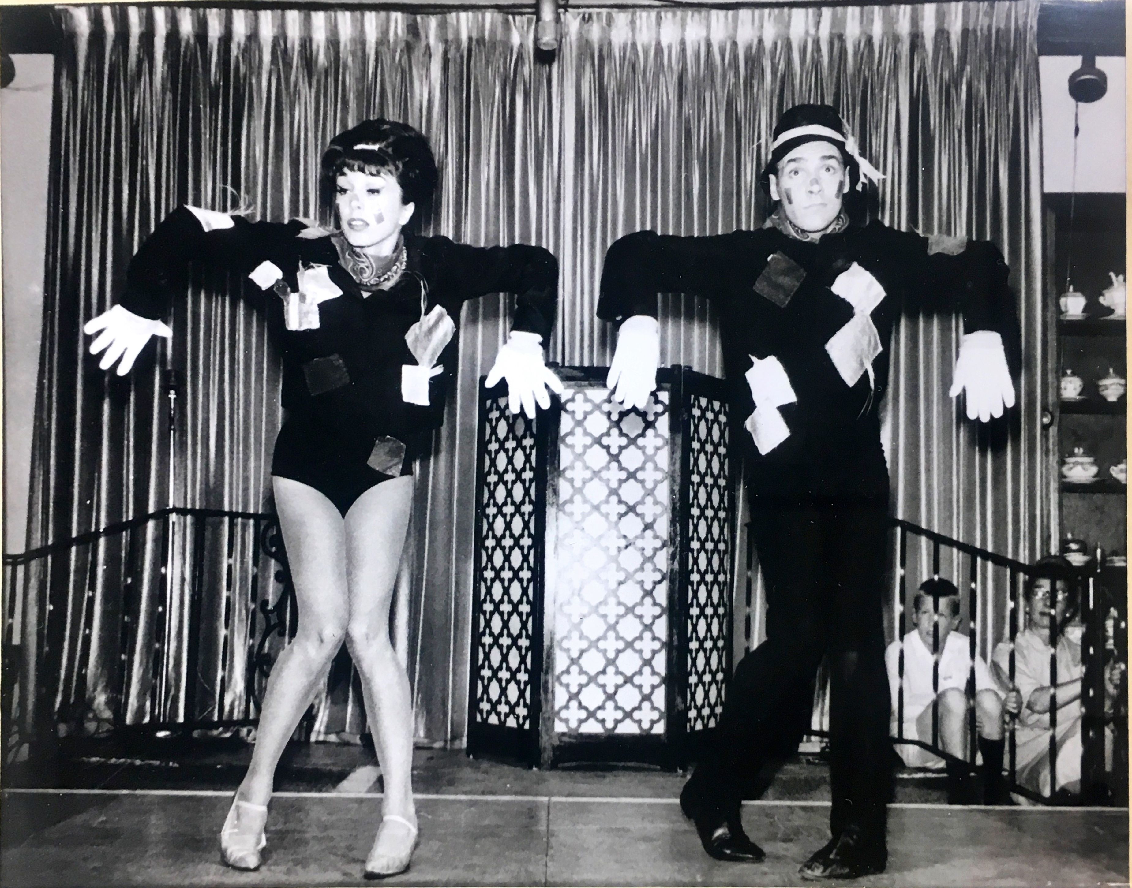a couple of people dancing on a stage