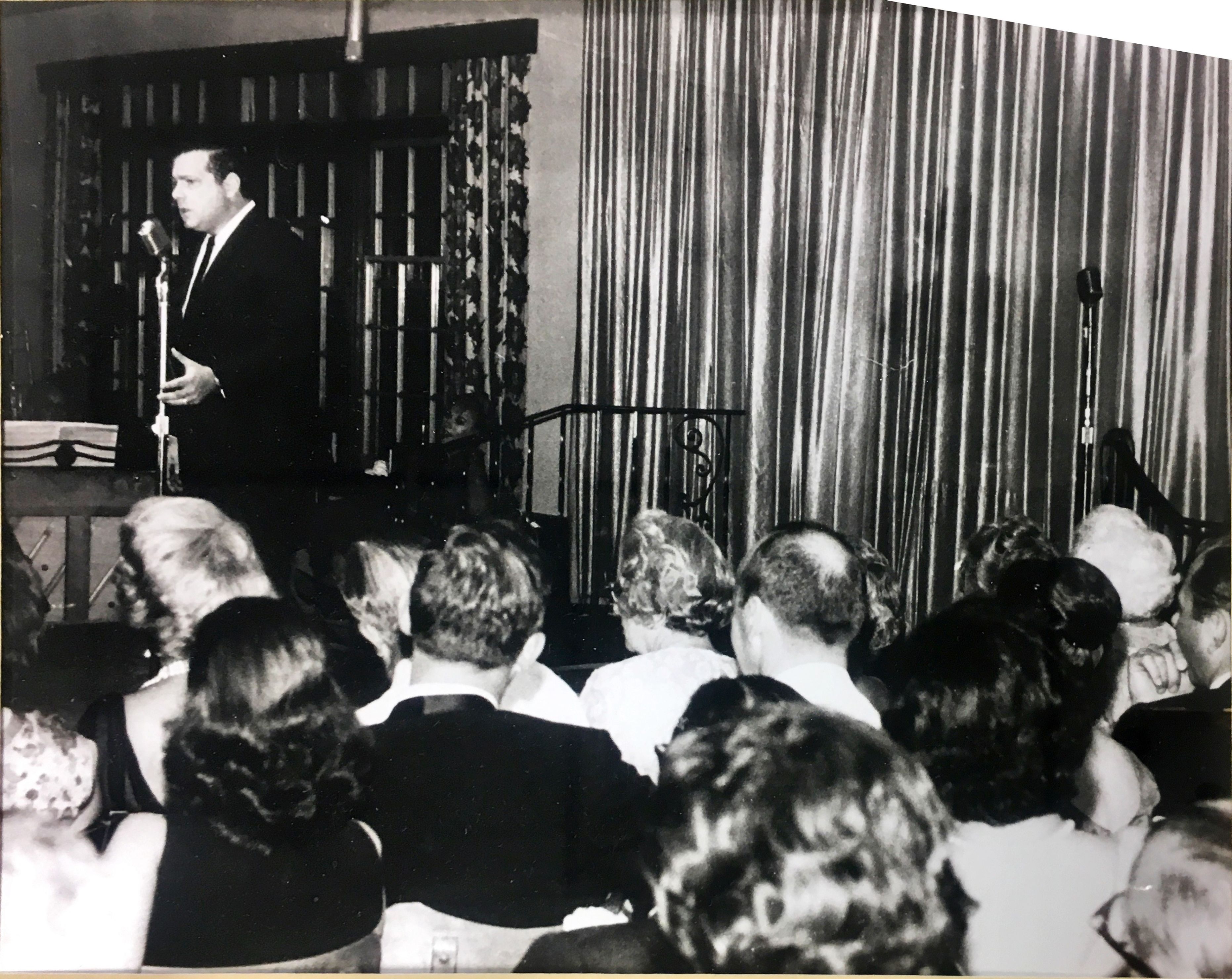 a man standing in front of a crowd