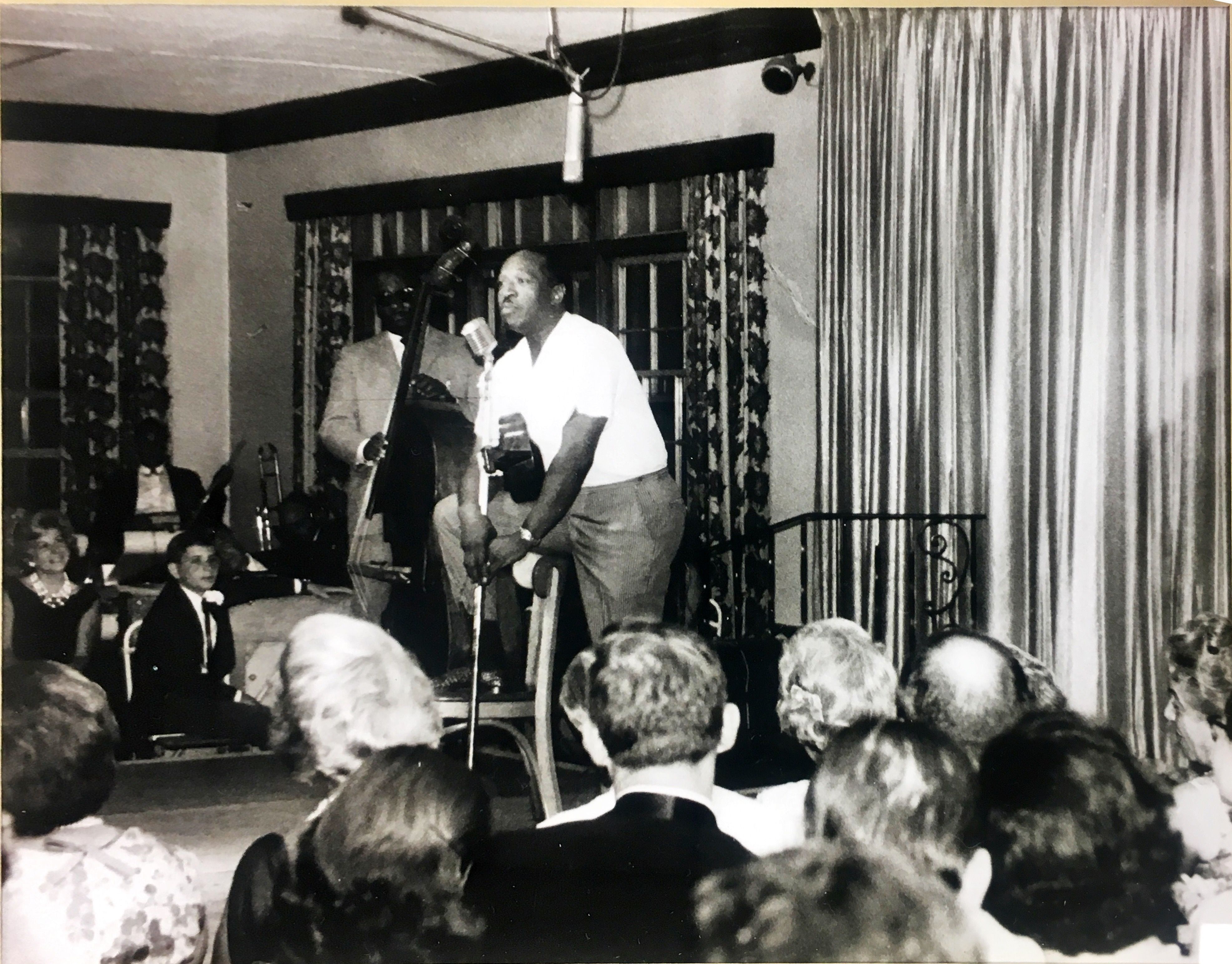 a group of men standing on a stage