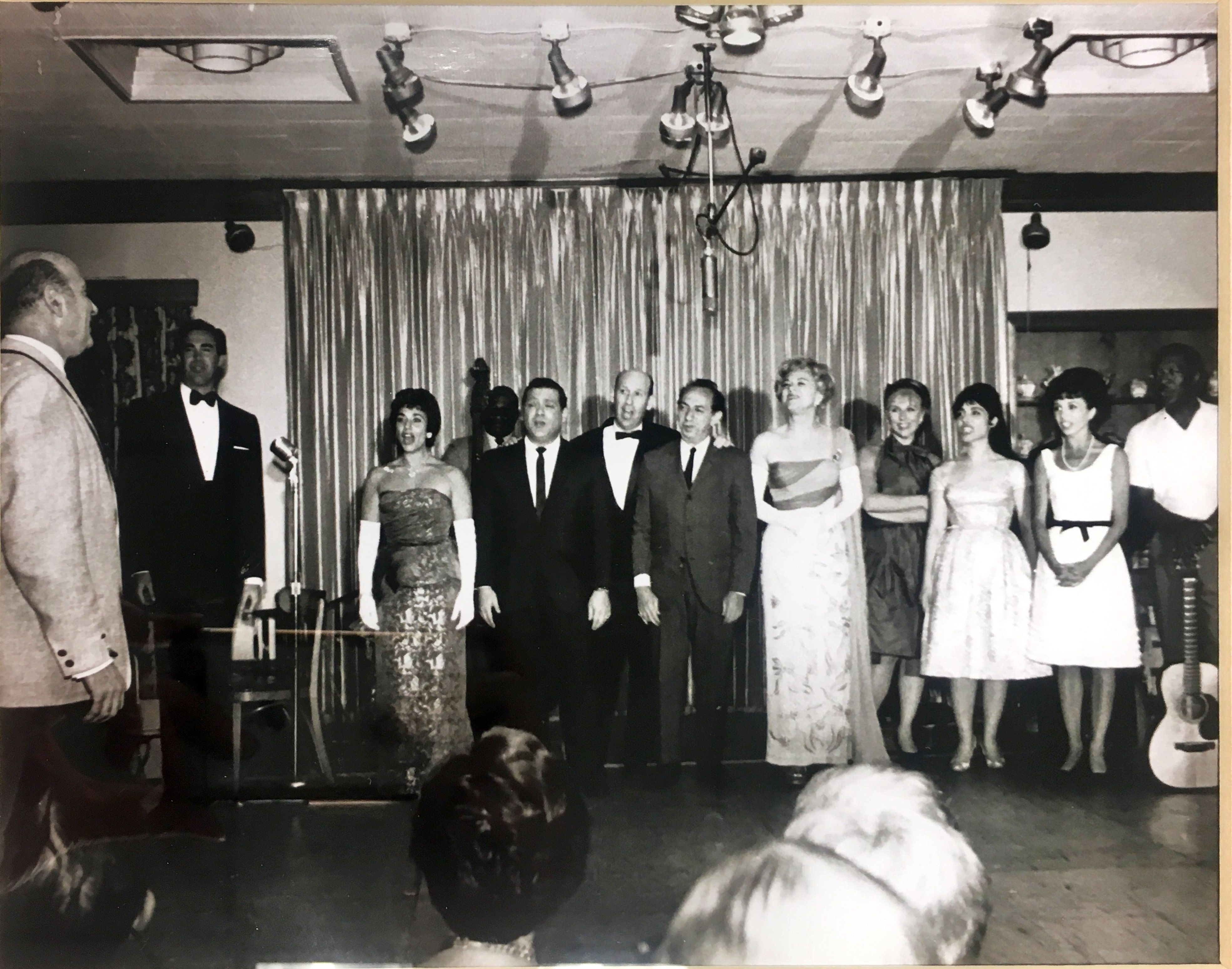 a group of people standing on a stage