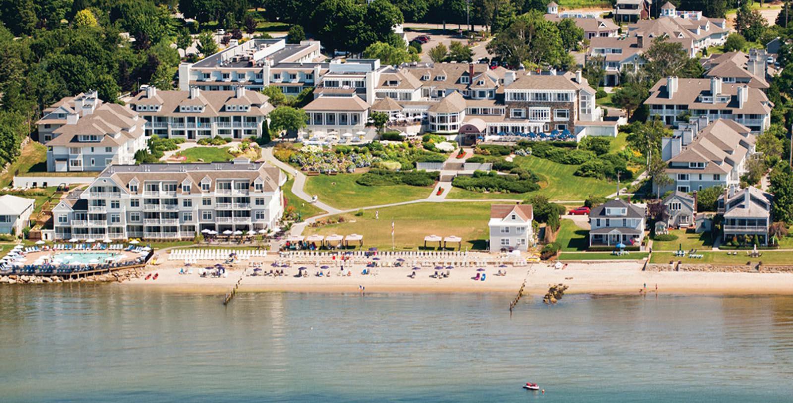a beach with many buildings and a body of water