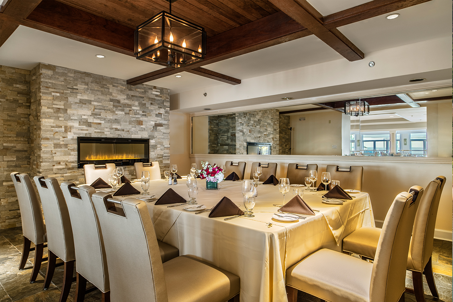a room with a table set for a dinner party