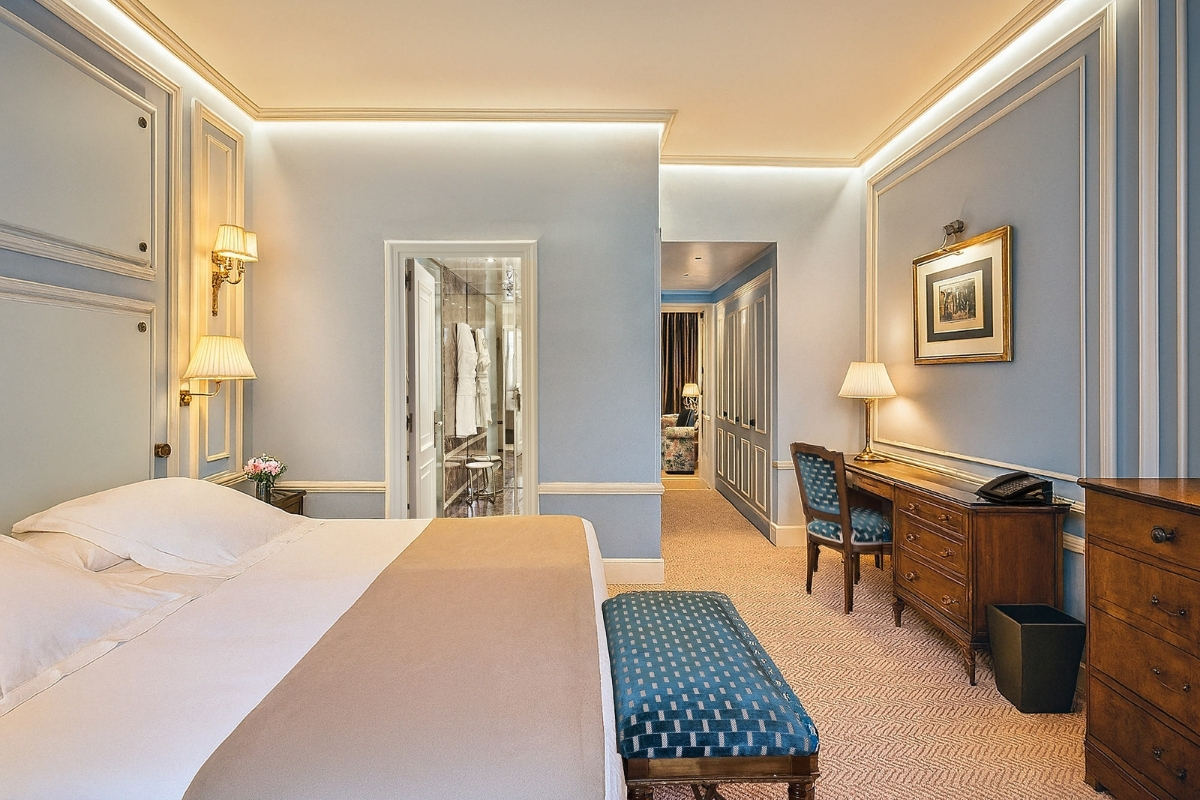 a bedroom with a bed and a desk