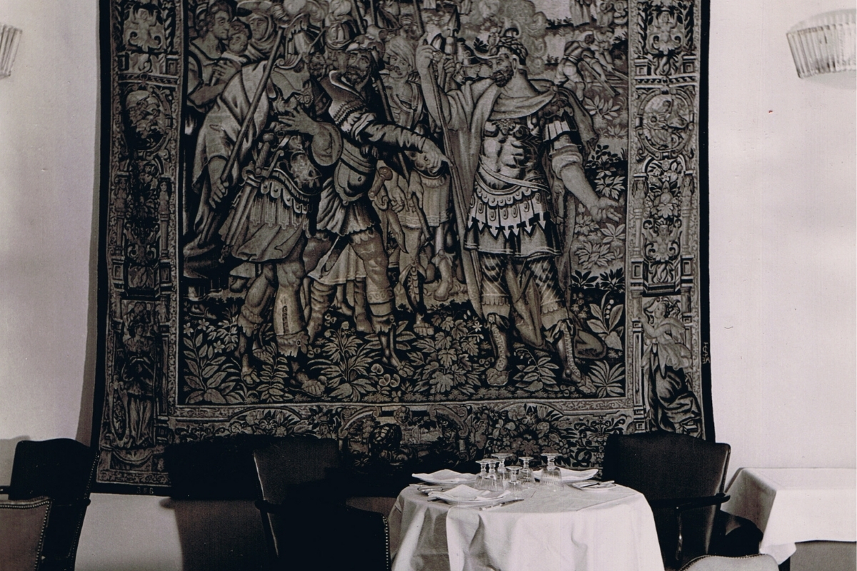 a table with a tapestry on it