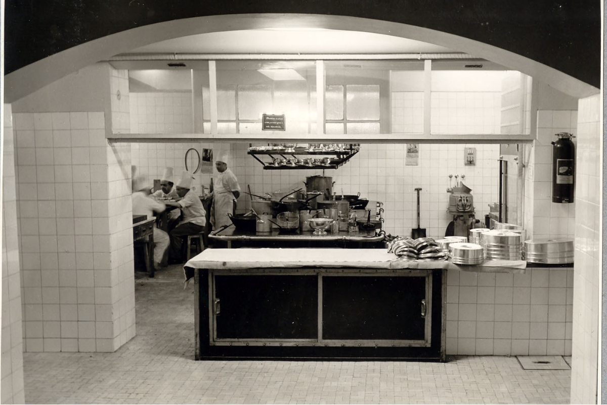 a kitchen with many pots and pans