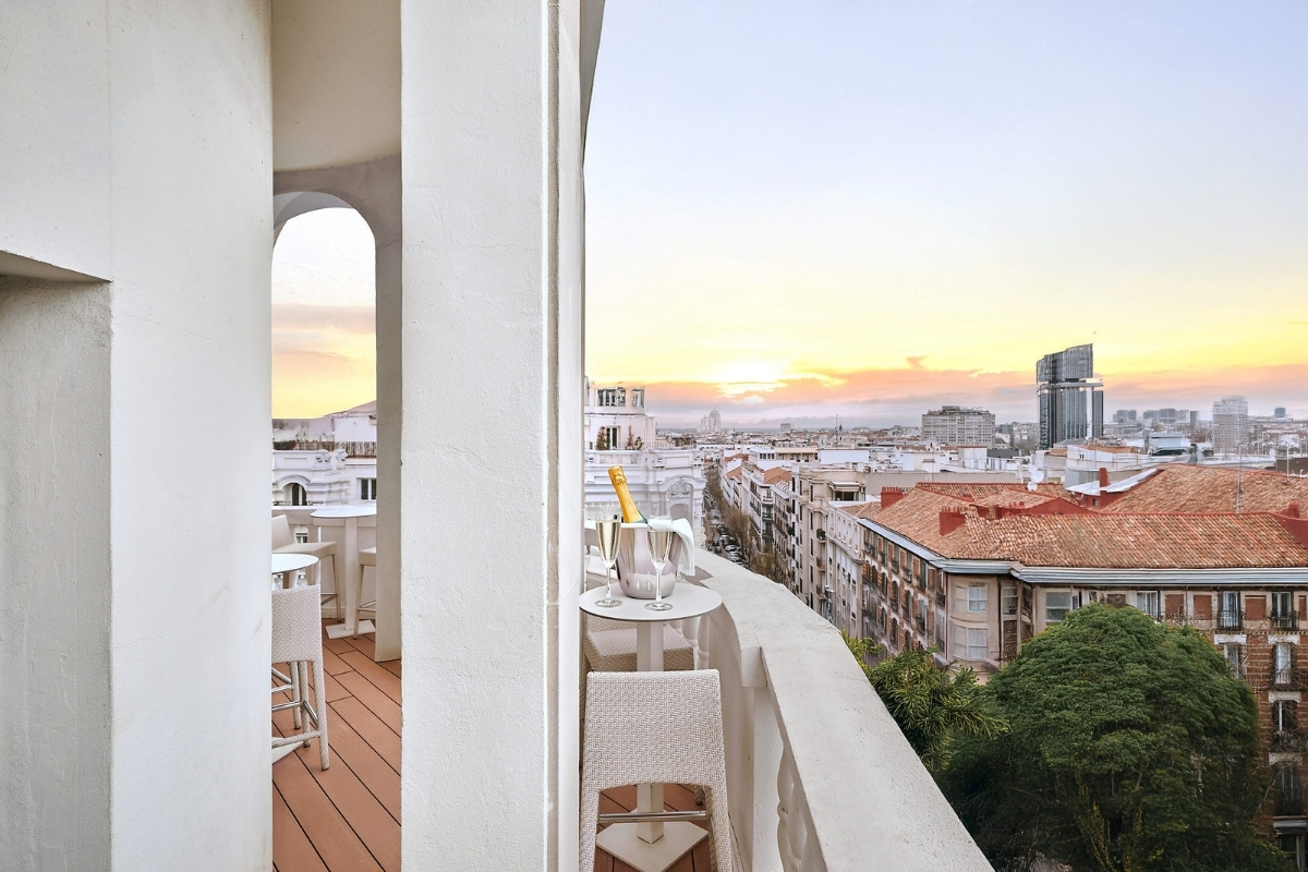 a balcony with a view of a city