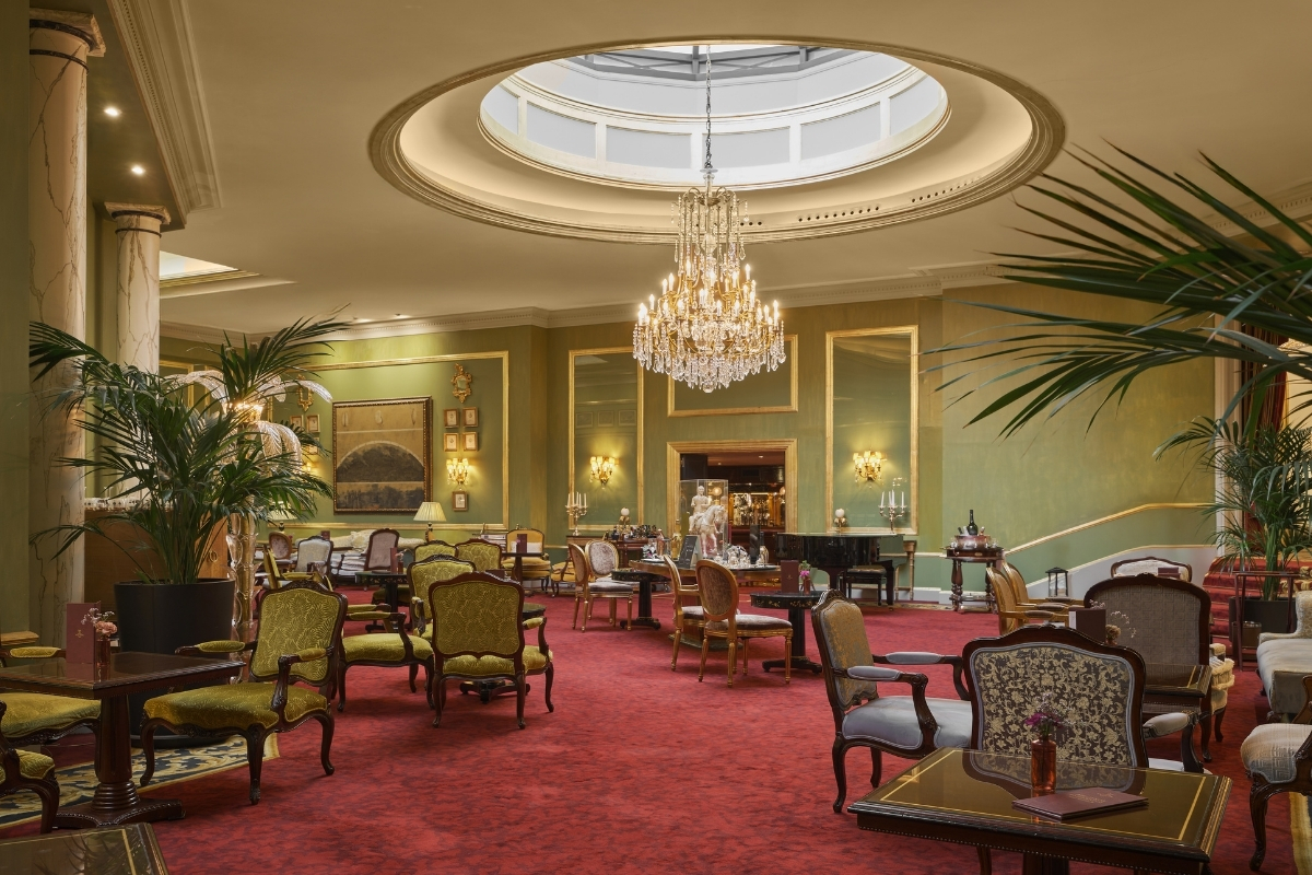 a room with a chandelier and chairs
