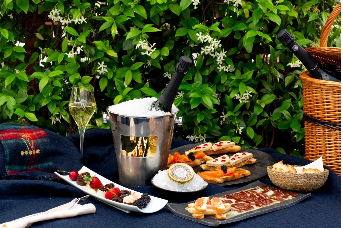 a table with food and a bucket of ice