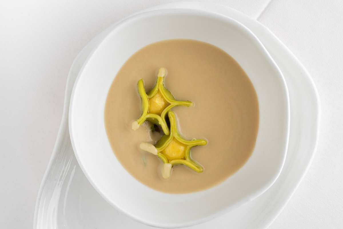 a bowl of soup with food in it