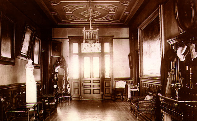 a room with a chandelier and chairs