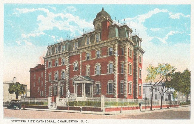 a large brick building with a domed roof