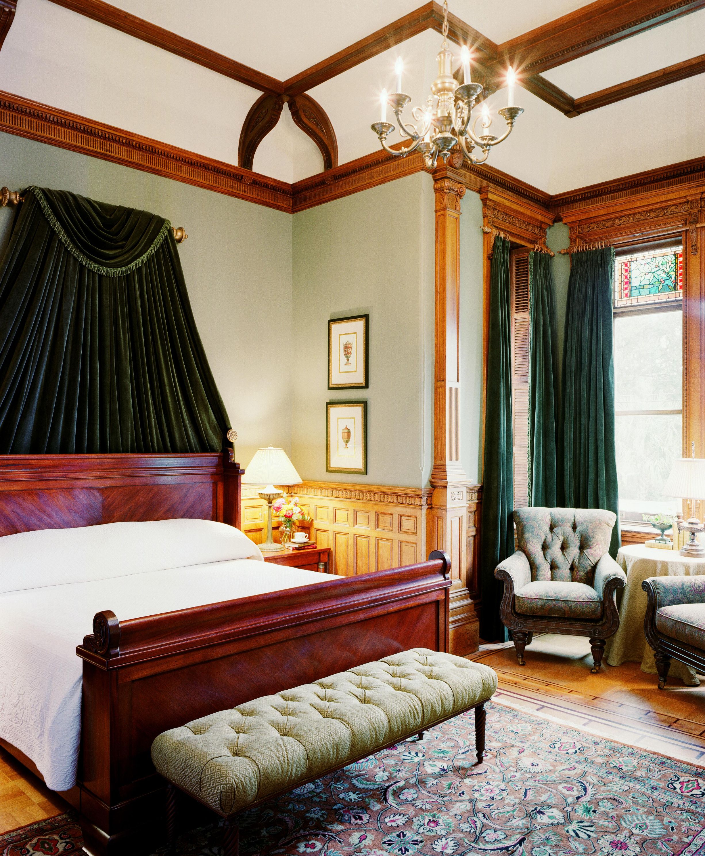 a bedroom with a bed and a bench