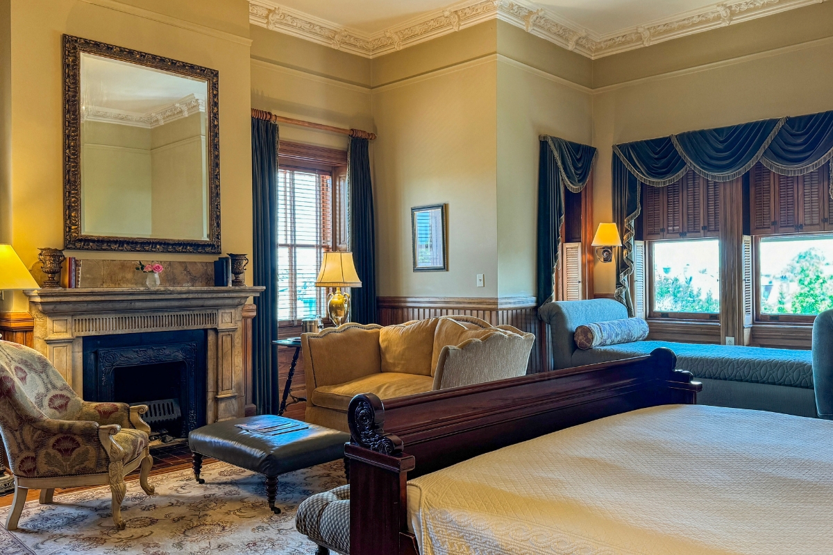 a room with a fireplace and a bed