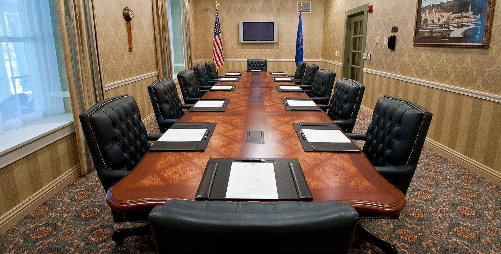 a conference room with chairs and a television
